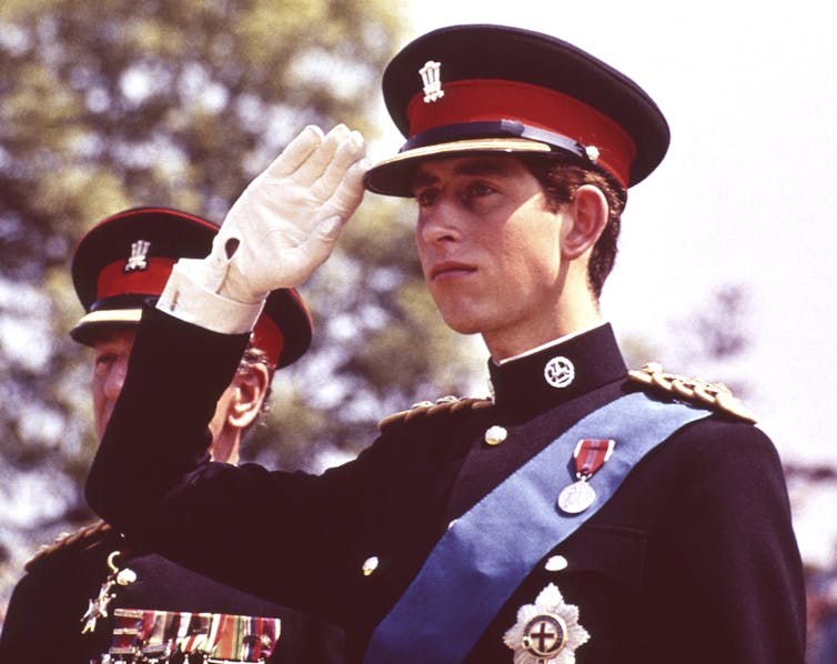 Young man in military regalia saluting