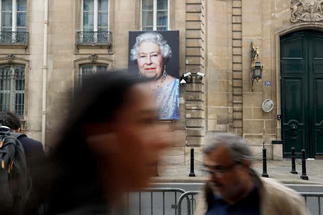 A portrait of Britain's Queen Elizabeth II outside the British embassy in Paris