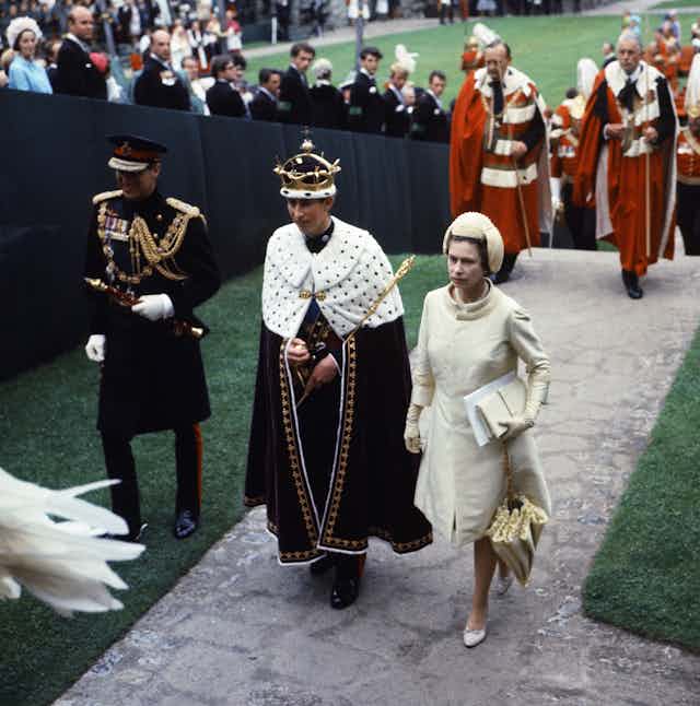 Investiture Ceremony of the Prince of Wales at Caernarfon Castle. Her Majesty Queen Elizabeth II and her son Prince Charles walk towards Queen Eleanor's Gate during the procession. 