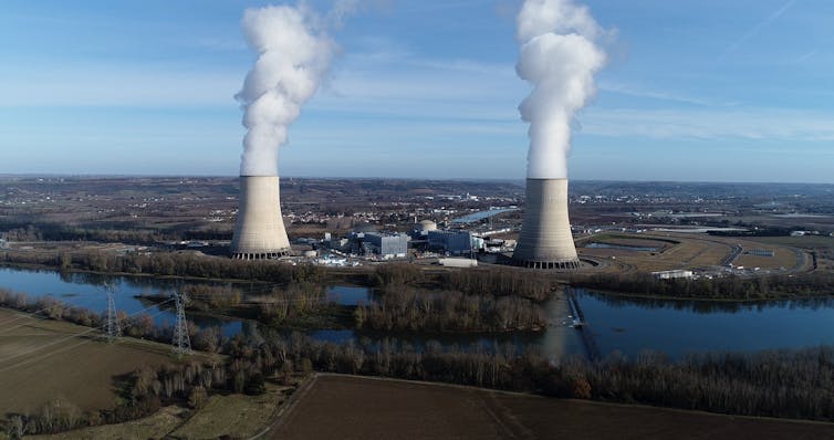 Aerial view of power plant beside river