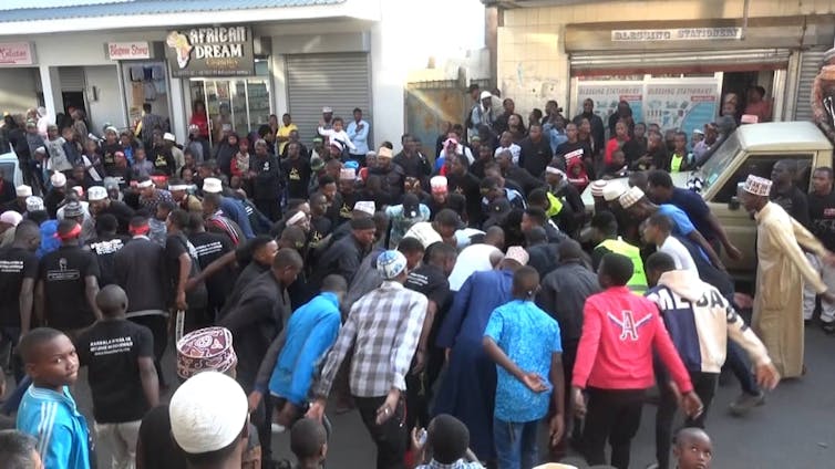 Circle of Shiite men beating their chests in lamentation