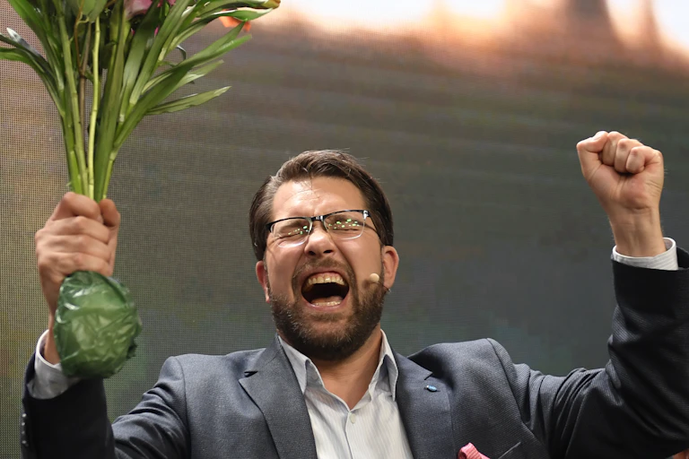 Sweden Democrats Jimmie Akesson cheering with his fist in the air.