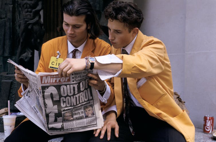 Two city traders reading the Daily Mirror after Black Wednesday