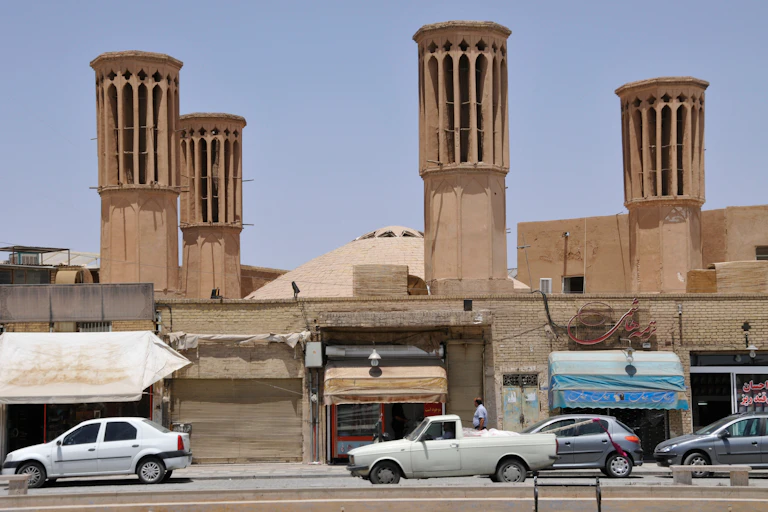 A building in Iran with four windcatchers on it, a type of chimney that acts as natural air conditioning.