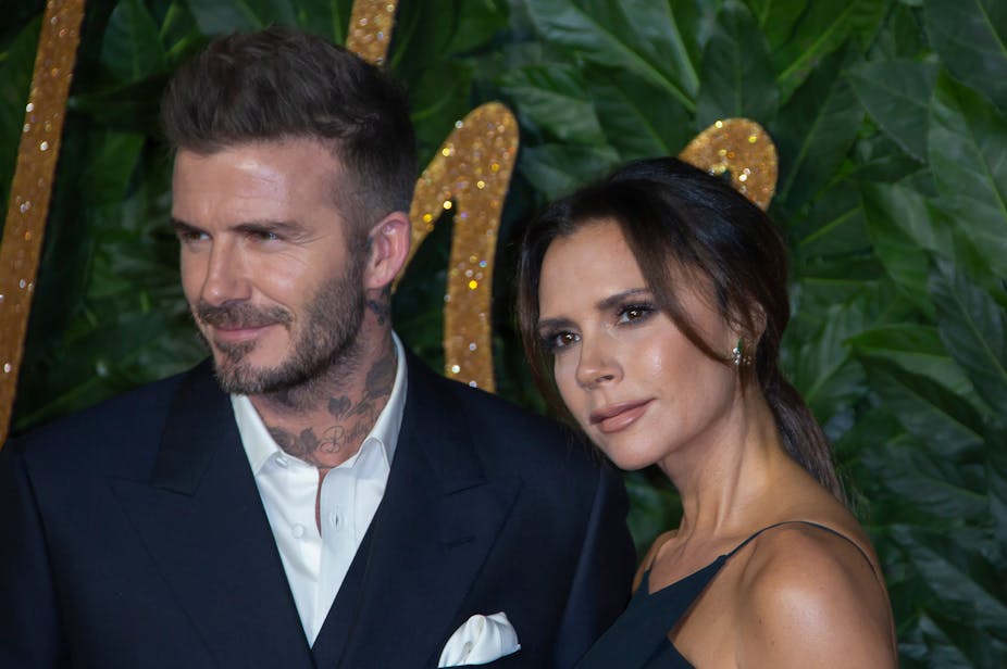 David and Victoria Beckham in formal clothing at an event