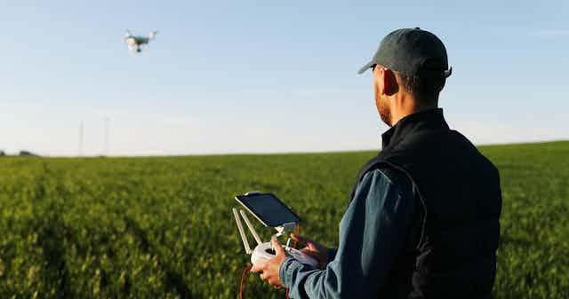 Farmer operating drone