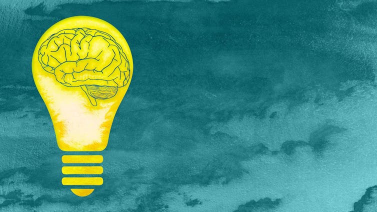 A drawing of a brain inside a yellow light bulb, on a green background.