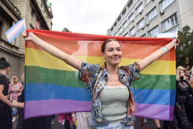 A participant holds a rainbow flag during an annual LGBT pride parade in Belgrade, Serbia, September 18, 2021.