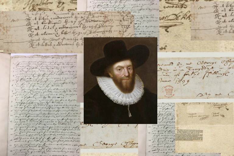 A man in a ruff and hat surrounded by old pages.