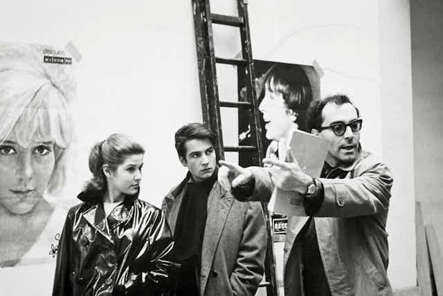 The French director Jean-Luc Godard directing a scene in the 1960s.