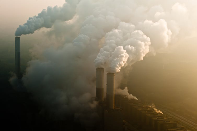 Smoke rising from chimneys at a coal power station.