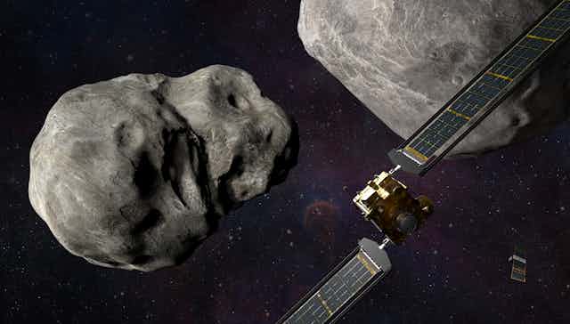 A spacecraft approaching a grey rock floating in space