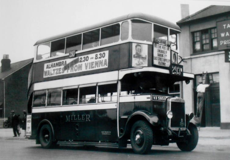 An archival photo of a bus in black and white.