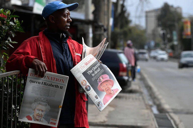 A newspaper vendor on the street