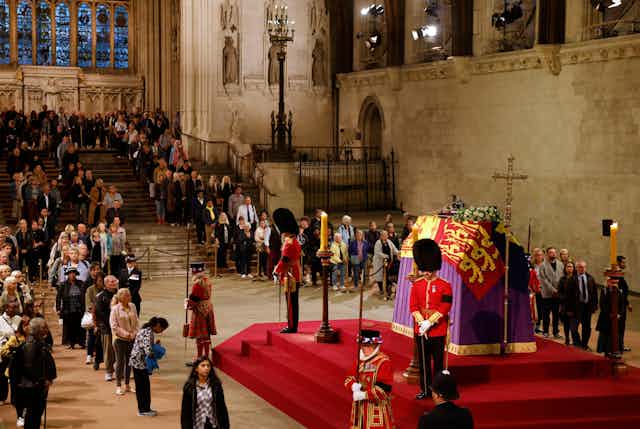 Members of the public visit the Queen's lying in state.