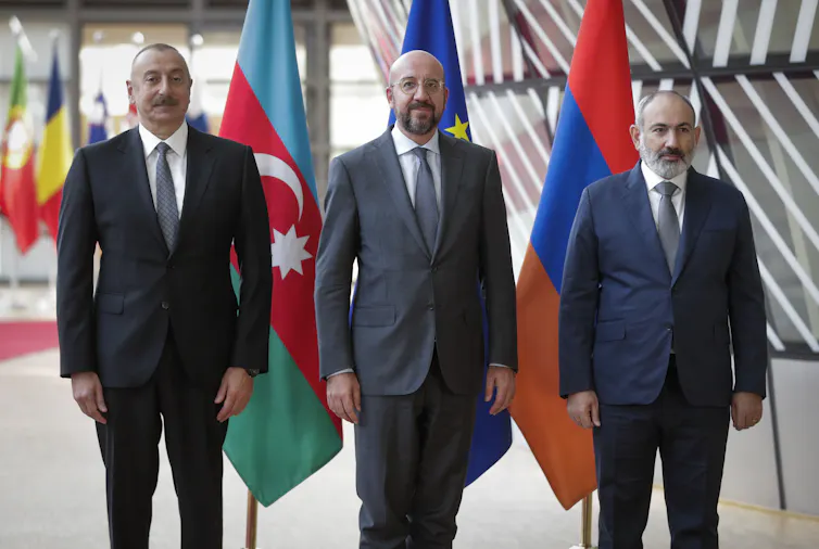 Azerbaijan's President Ilham Aliyev (L) and Armenia's Prime Minister Nikol Pashinyan are welcomed by the European Council President Charles Michel (C) in Brussels, Belgium, 31 August 2022.