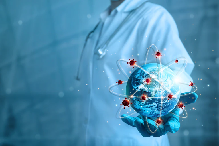 the torso of a scientist holding a globe surrounded by orbiting atoms