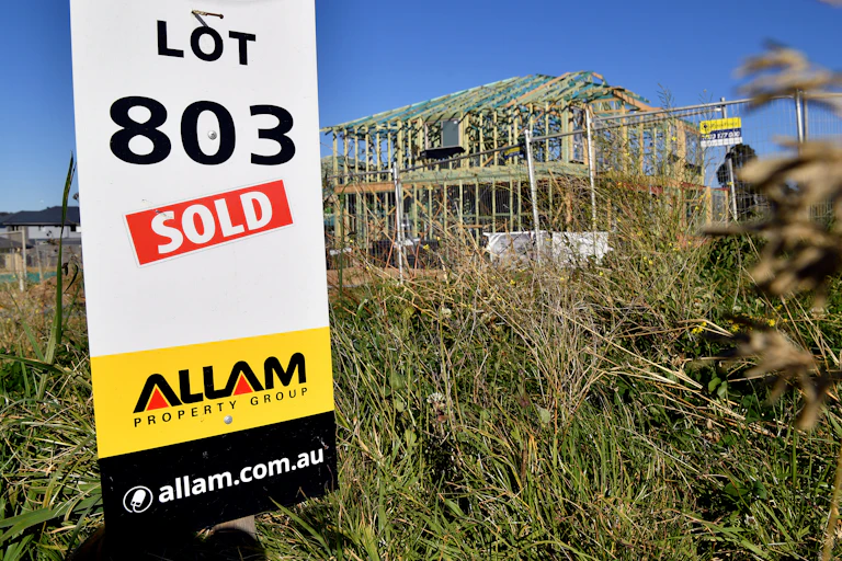 Sold sign of land being developed for housing