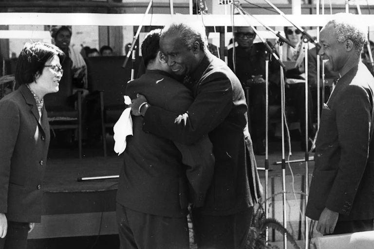 July 1976: President Nyerere (right) watches as President Kenneth Kaunda of Zambia greets Chinese Vice-Premier Sun Chien at the handing over ceremony of the Tanzania- Zambia railway.