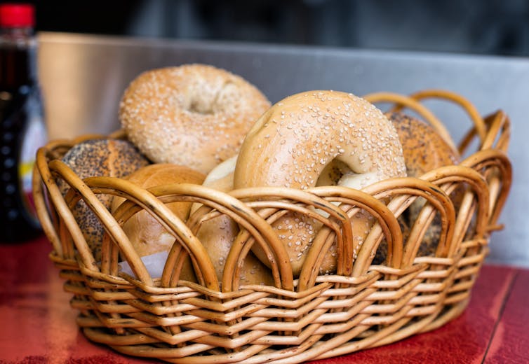 Wicker basket with bagels in it