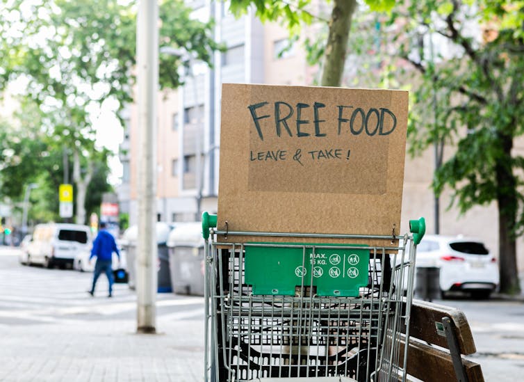 Supermarket trolly with sign saying