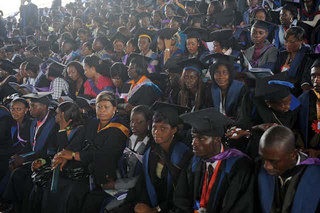 Graduate students listen to Nigerian President Goodluck Jonathan's (unseen) speech during his visit at his alma mater in the University of Port Harcourt in Rivers State on, May 15, 2010. 