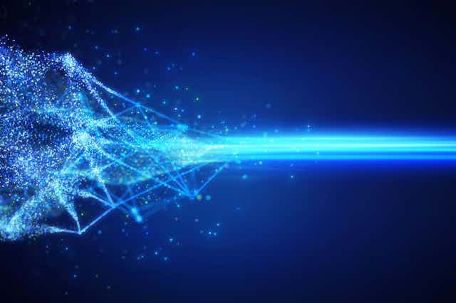 Bright flashes bounce around and then join into a a focused beam