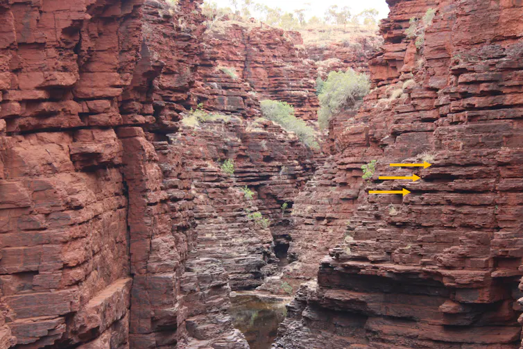 Reddish rocks with a layered texture and colours.