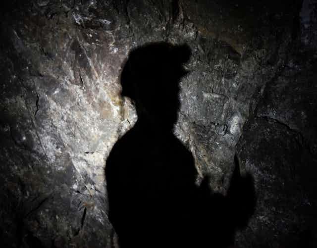 Silhouette of a miner