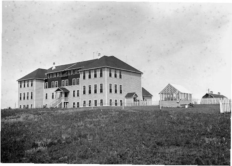 A black and white photo of a school building