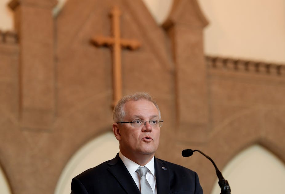 Scott Morrison at a church in front of a cross
