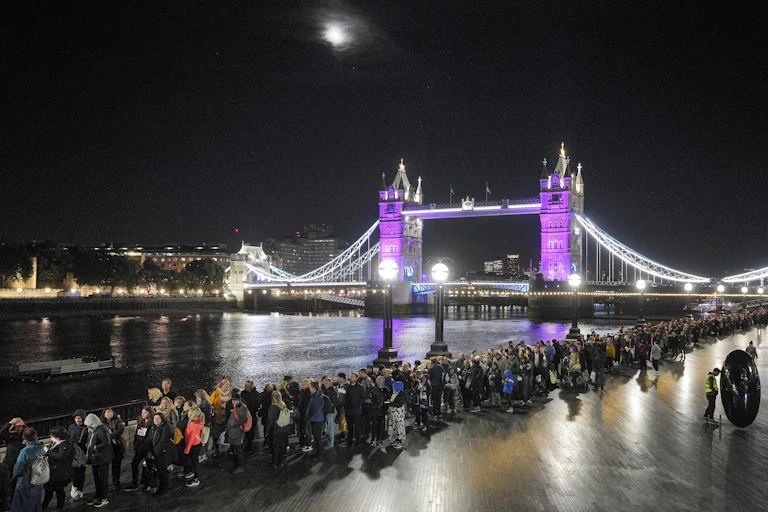 People queue to see the queen lying in state.