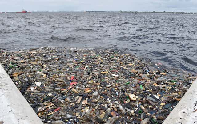 Plastic and other debris floating in the ocean.