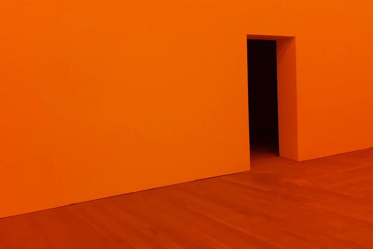 Orange wall, with door opening, orange floor