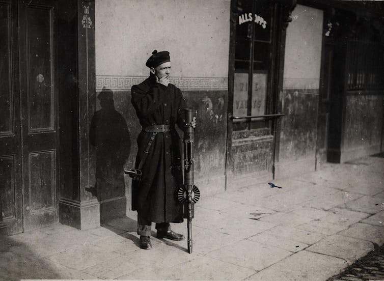 Old image of a soldier smoking.