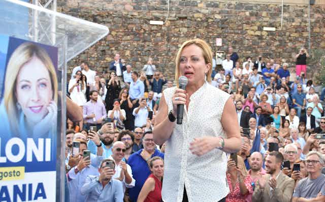 Giorgia Meloni speaking at a rally.