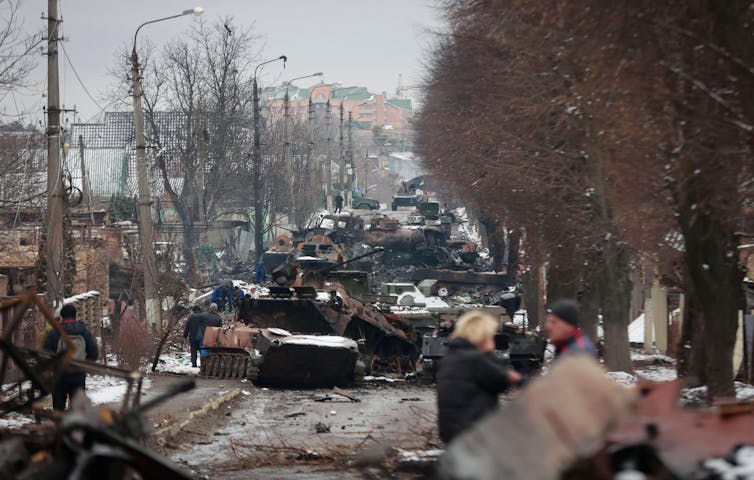 Abandoned tanks in a city street.