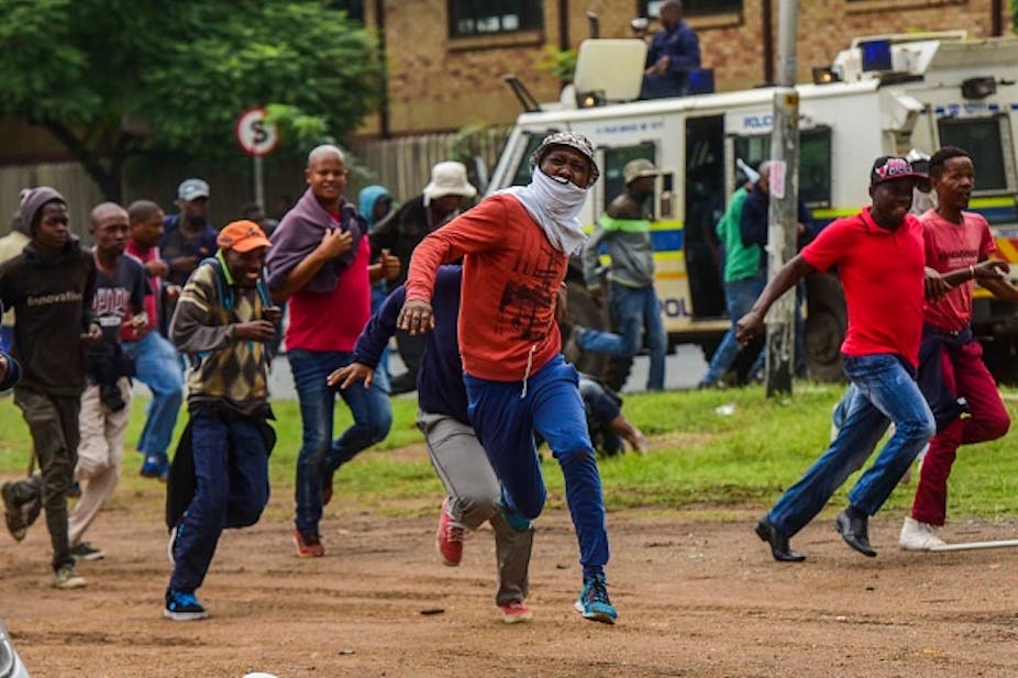 men running from police