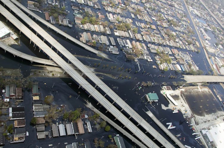 as seen from this aerial photograph, a major highway cuts through a residential neighborhood.