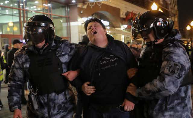Russian policemen detain a participant of an unauthorised protest against the partial mobilisation due to the conflict in Ukraine, in central Moscow, Russia, 21 September 2022.