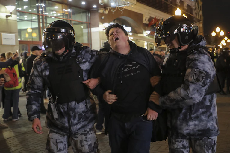 Russian policemen detain a participant of an unauthorised protest against the partial mobilisation due to the conflict in Ukraine, in central Moscow, Russia, 21 September 2022.