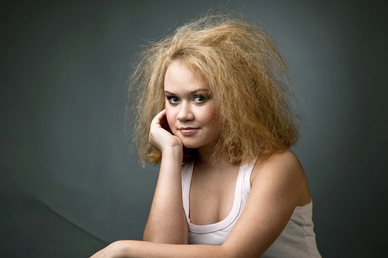 Person with uncombed blond hair