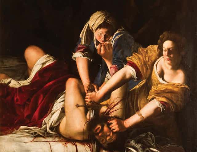 Two women cutting off the head of a man, with a dagger.