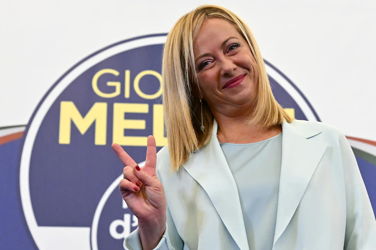 Giorgia Meloni making a peace sign.