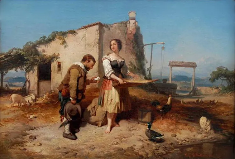 Un hombre baja la cabeza mientras habla con una campesina.
