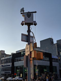 Security cameras on a pole in New York City.