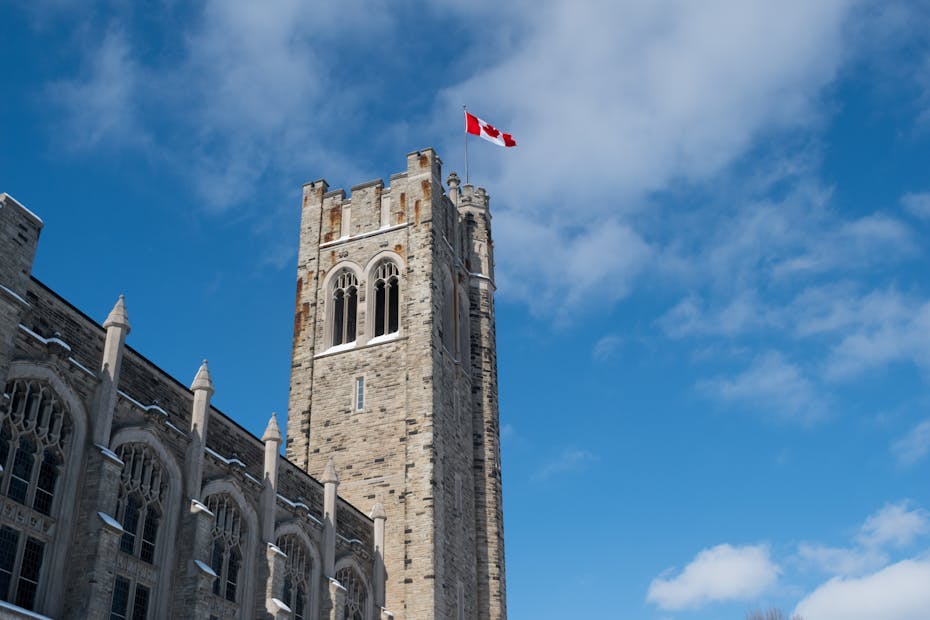 A flag seen on top of a tower.