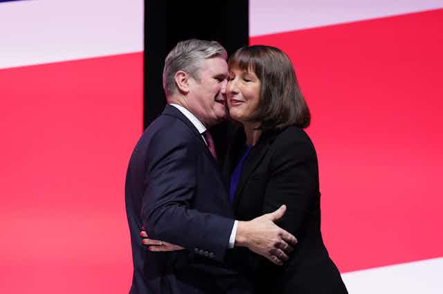 Keir Starmer and Rachel Reeves embrace on stage at Labour conference.