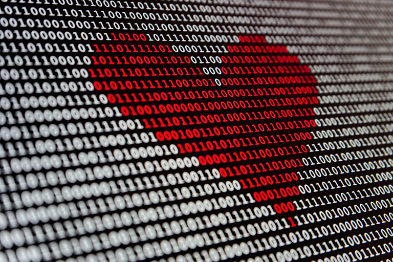 Binary black and white code with a red heart in the middle