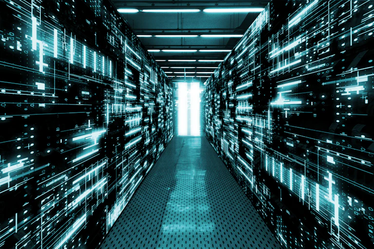 Digital image of server stacks lit with a teal light